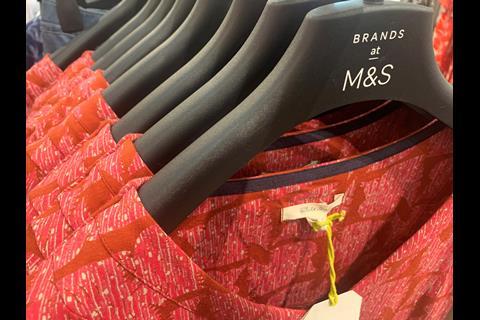 Clothing hanger promoting third-party brands at M&S Stratford
